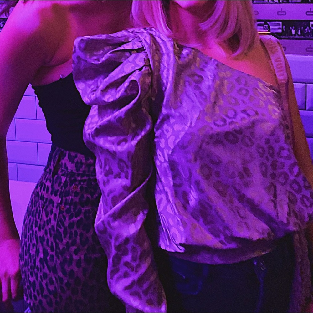 DO+BE Shiny Leopard Print Asymmetrical Statement Sleeve Top with Bow Detail